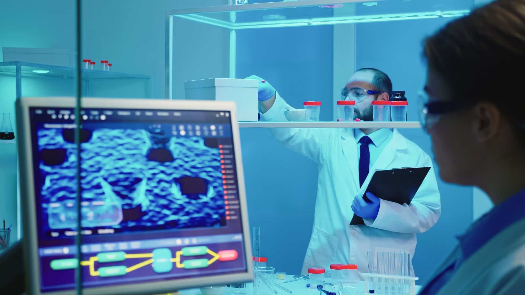 OIC - Meeting Organization - laboratory medical research Researchers working in a medical laboratory, analysing samples and scientific data.